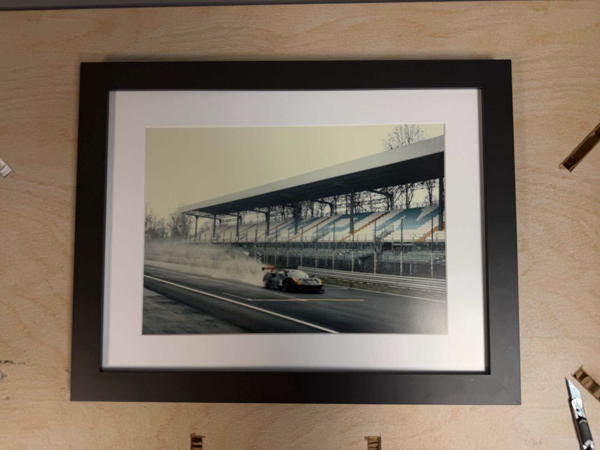 Framed race car photograph at Monza grandstand